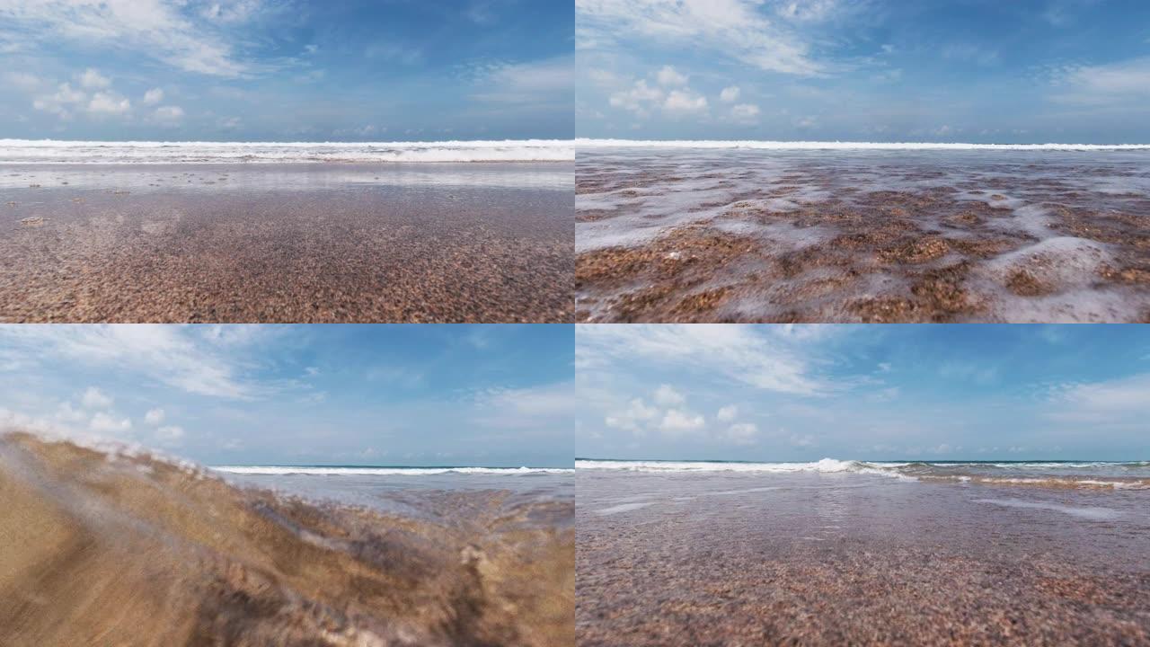 海水波浪在海滩上的摄像机上泛滥成灾