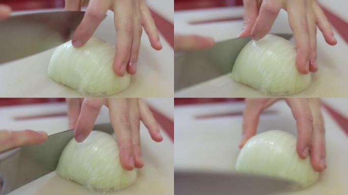 高加索厨师用一把大菜刀将洋葱切成薄片