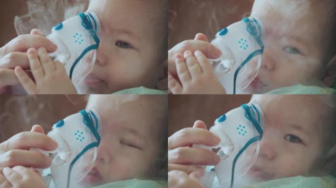 慢动作: 雾化器治疗生病的婴儿。