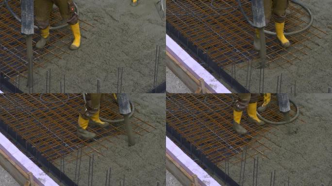 建筑工人在浇筑基础底板施工时