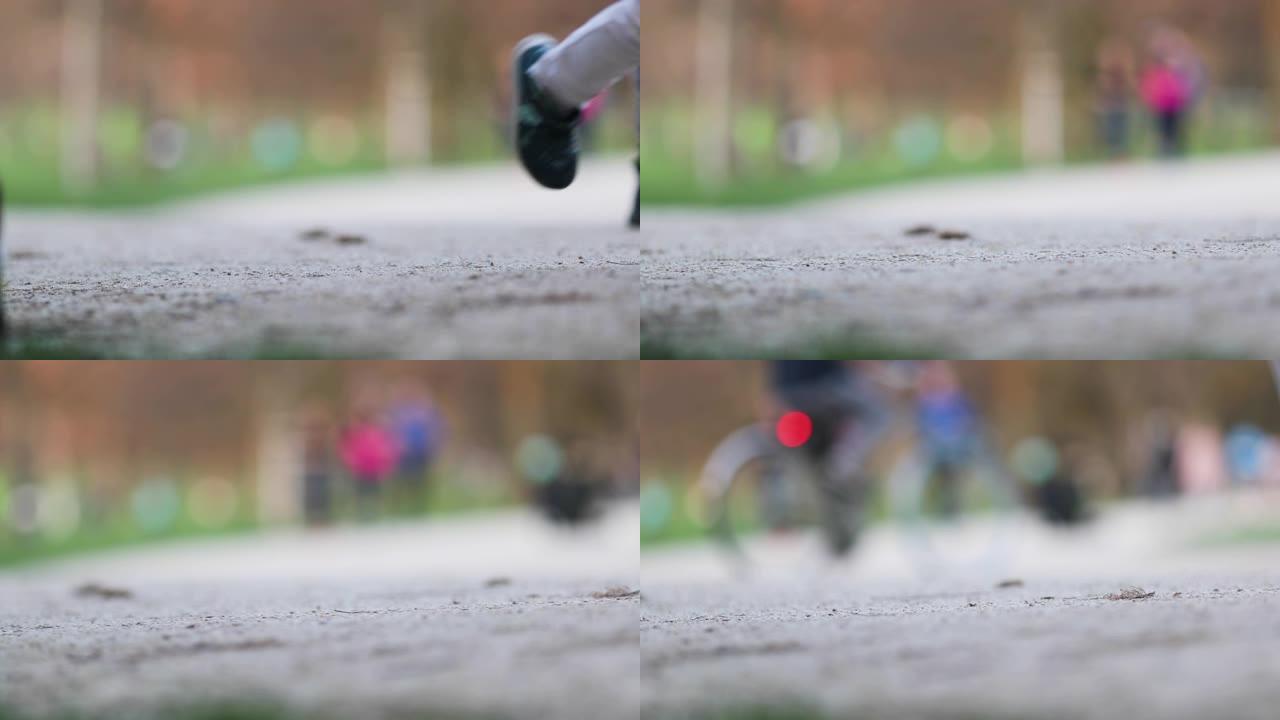 公园里男孩儿脚的低角度跟踪镜头