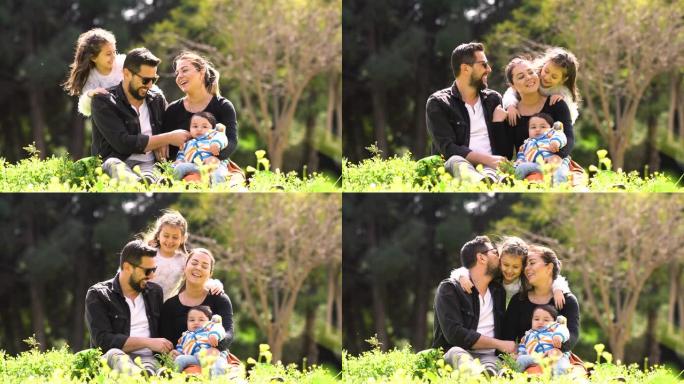 一个幸福的家庭的4k镜头，有男女孩子在公园欢呼