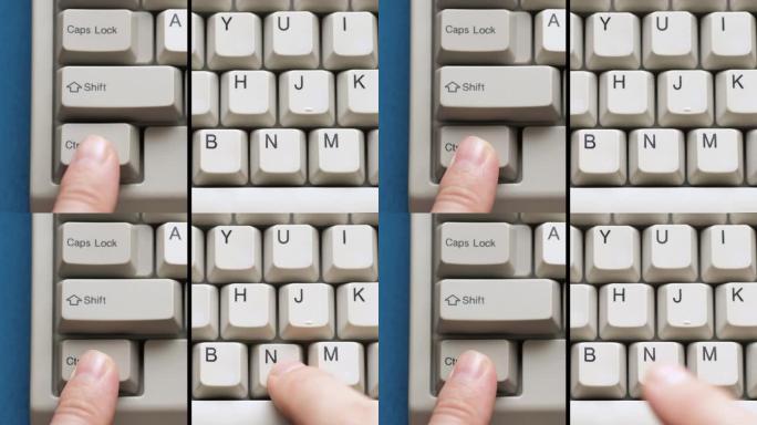 男性手指按下白色键盘上的CTRL N按钮。慢动作和宏观视图