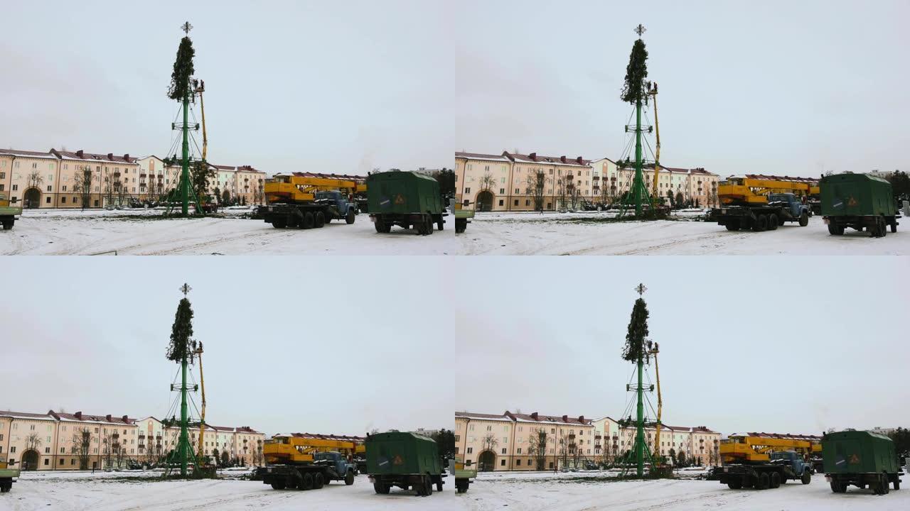新年假期和庆祝活动结束后，工人们在城市的主要中心广场拆卸了圣诞树结构。第8部分。冬季的高空作业平台。