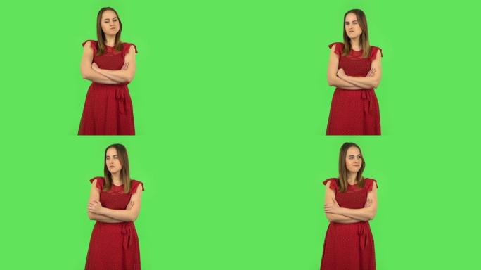 穿着红色连衣裙的温柔女孩非常生气，把目光移开。绿屏