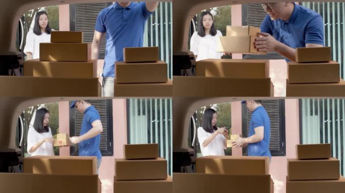 亚洲送货员在交付给女性顾客之前，在送货车的后部检查并携带纸质包裹箱。邮政递送服务的概念.4k UHD