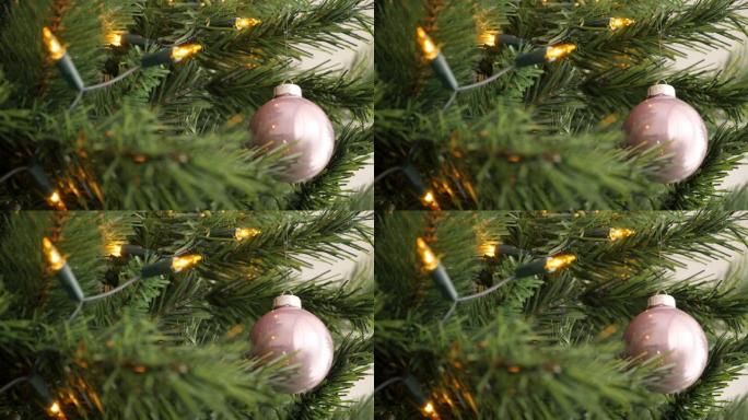 人造圣诞树上闪亮的粉色玻璃摆设4K