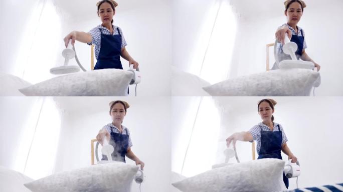 慢动作拍摄亚洲妇女清洁卧室与蒸汽蒸汽清洁剂，家庭主妇清洁房子良好的家庭保健