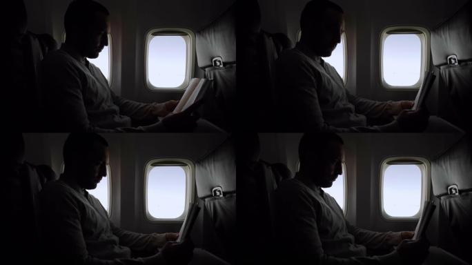 飞行中的人读书飞机看书男人商务舱