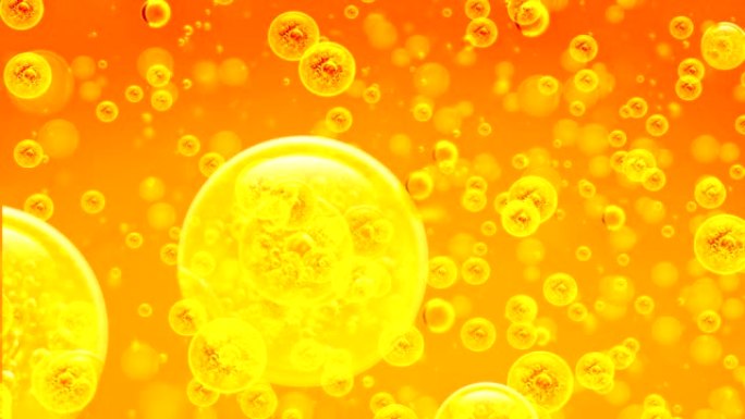 气泡中的金色气泡。向上运动。背景是金橙。项目，油，蜂蜜，啤酒，果汁或其他变体的金液体中的气泡。