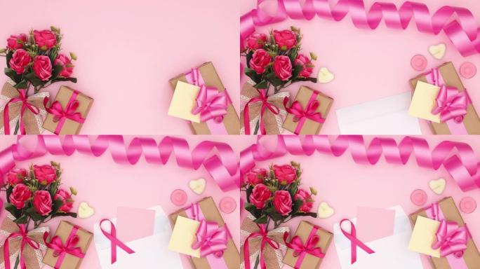 情人节，母亲节或妇女节的粉红色背景上的鲜花，礼物和女性配饰-停止运动