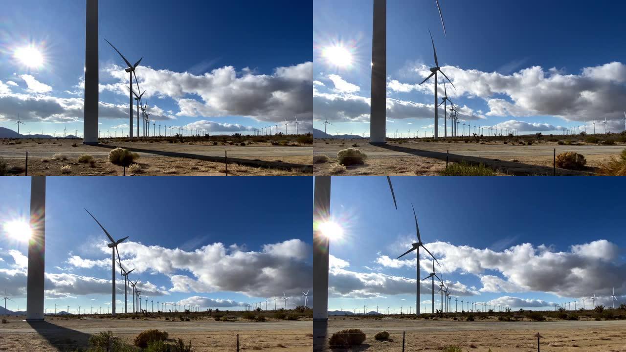 在加利福尼亚沙漠中驶过大型风力涡轮机
