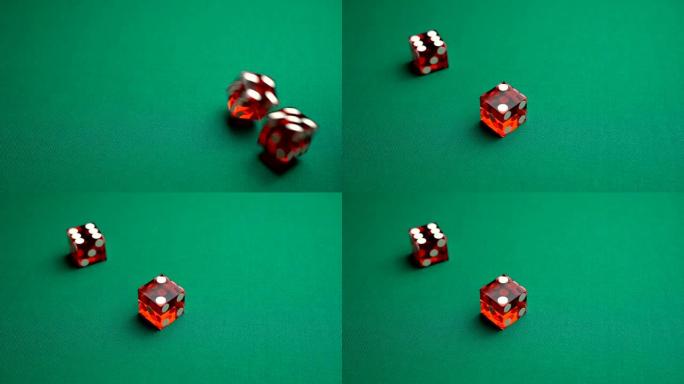 经销商掷骰子七个。慢动作两个红色骰子，掷骰子，扔在赌场的绿色tomentum背景上，自然或七个。成人