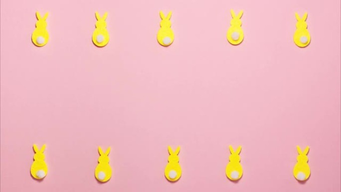 粉红色公寓上的复活节黄色兔子
