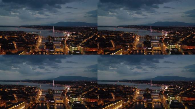 夜间照明飞行在日内瓦市中心湖滨湾空中全景4k瑞士