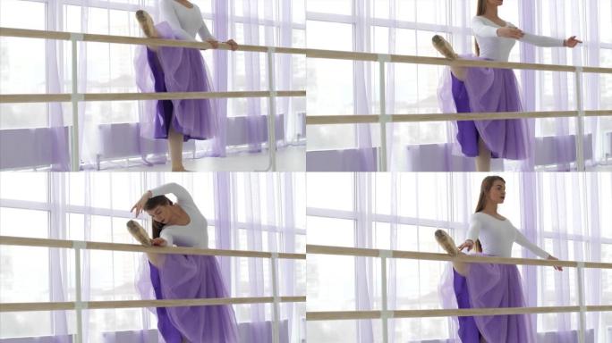 职业芭蕾舞女演员将腿放在架子上。