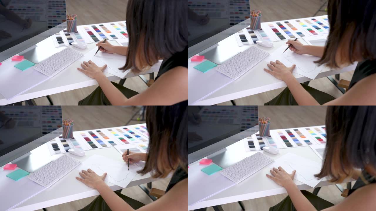 创意设计师在工作台上在纸上绘画和素描新思路