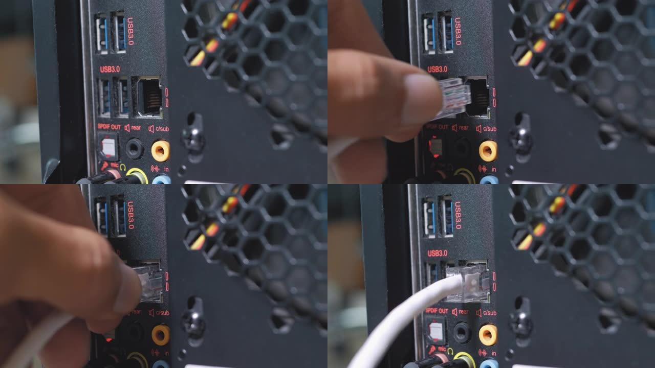 人的手在计算机端口中插入并插入usb 3电缆，LAN电缆，音频和麦克风电缆。