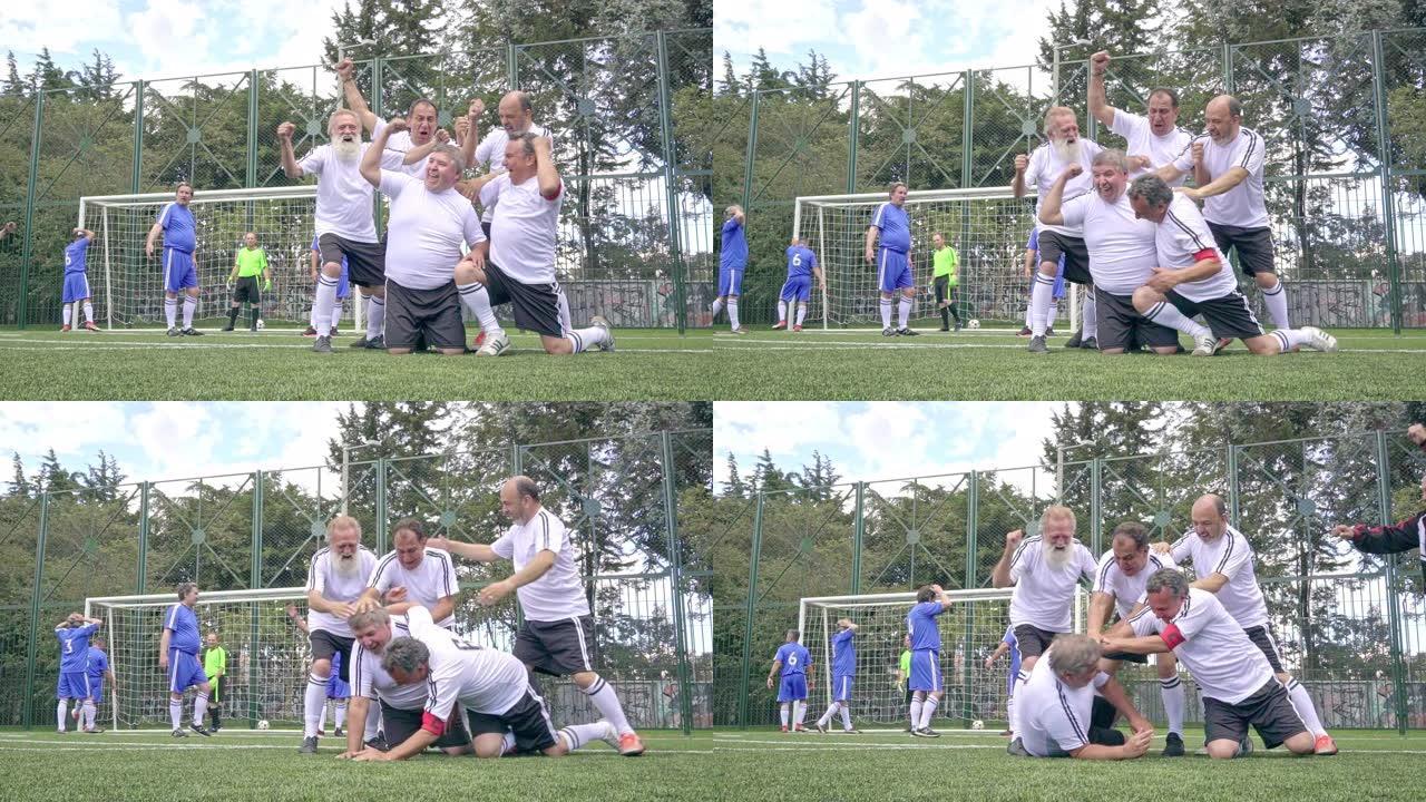 穿着蓝色和白色制服的老年男子足球队正在比赛中，白队聚集在一起庆祝进球。