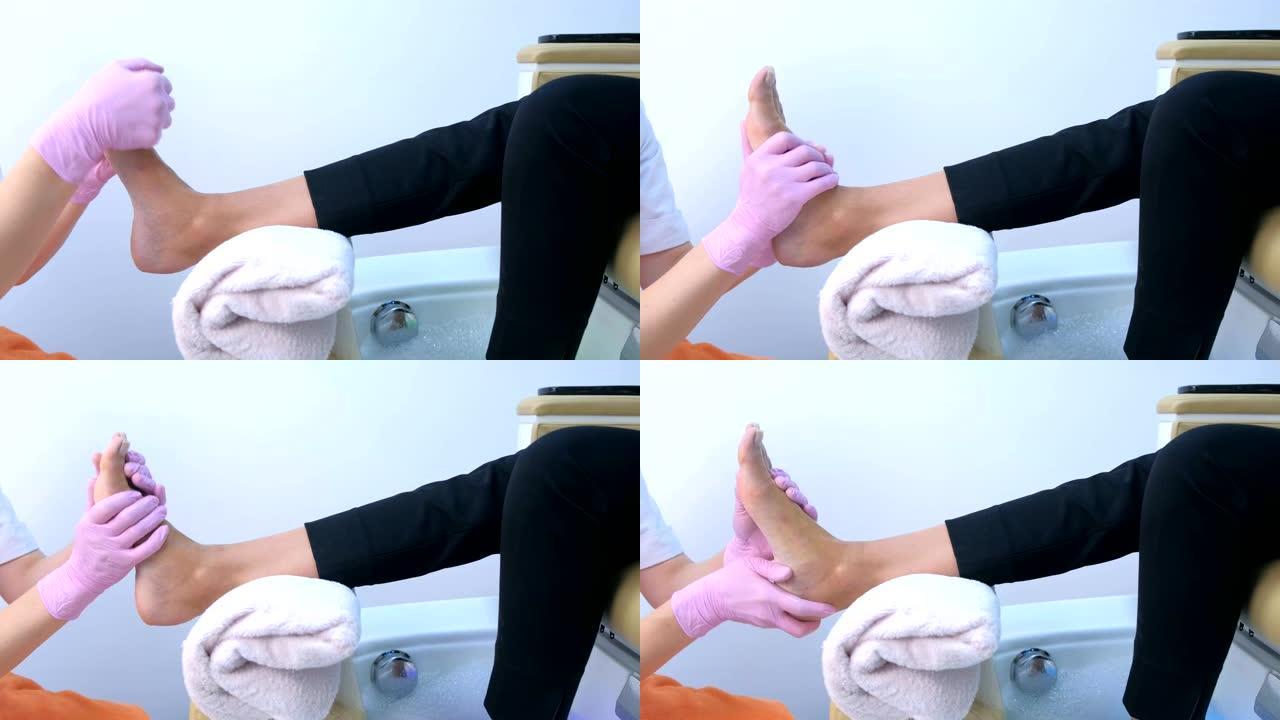 修脚的女人做脚按摩使用面霜，美容程序。