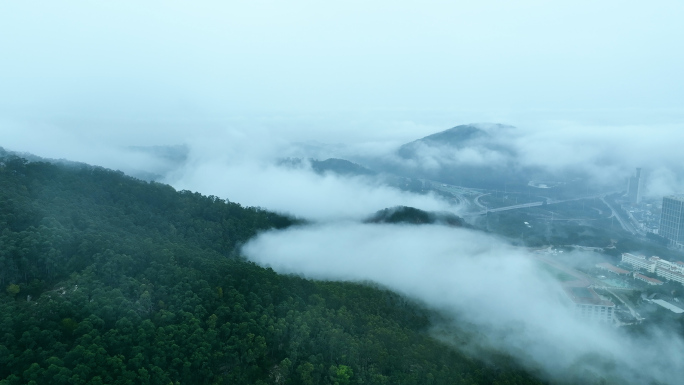 唯美意境的山顶雨雾城镇公路4K航拍
