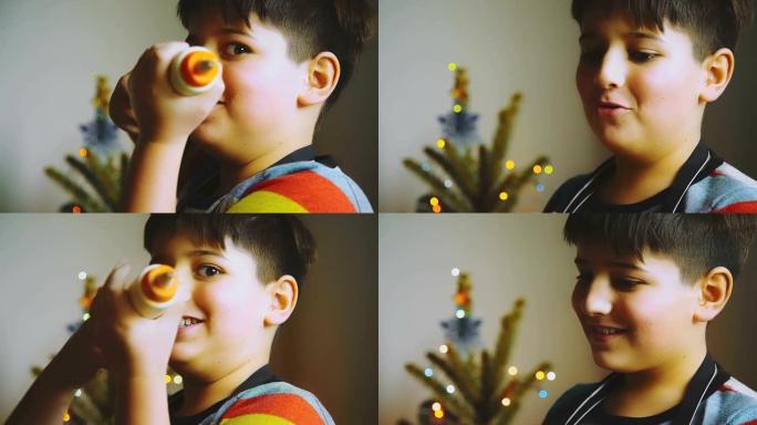 男孩玩糖果注射器男孩玩糖果注射器