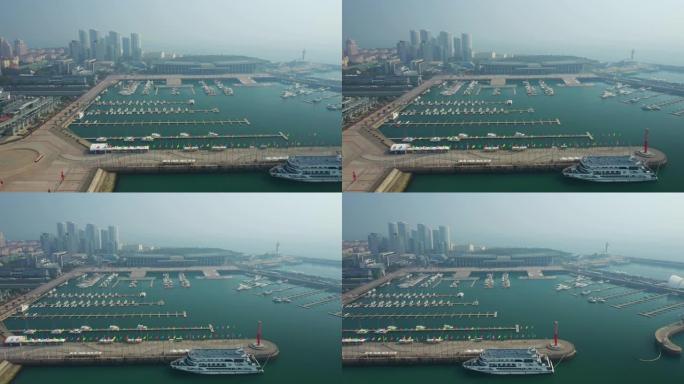 晴天青岛市著名奥林匹克湾广场游艇码头空中全景4k中国