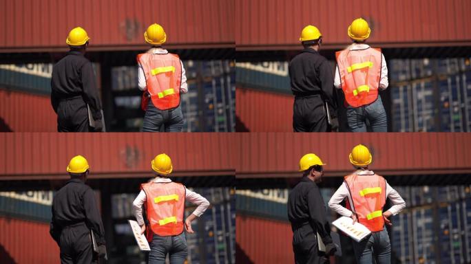 工头和工程师控制从货物运输中装载集装箱箱