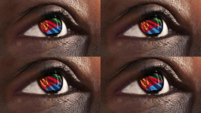 女子黑眼睛在近距离与国旗厄立特里亚在虹膜与风运动。视频的概念