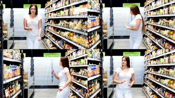 在一家大型超市里，一个穿着白色衣服的年轻漂亮女孩的有趣舞蹈
