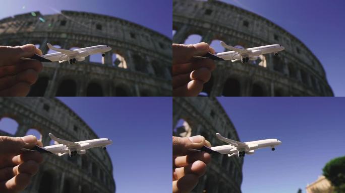 旅程。一架玩具飞机在历史悠久的体育馆大楼的背景下飞行。罗马。意大利。