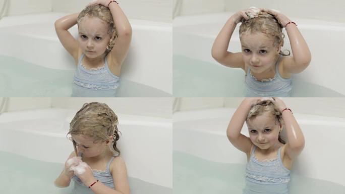 可爱的金发女孩穿着泳衣洗澡。小孩洗头