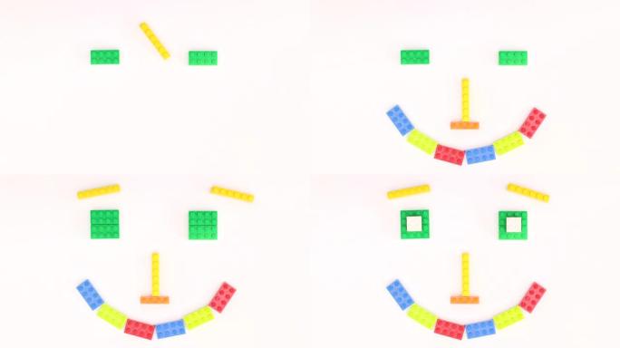 彩色砖块玩具在白色背景上制作笑脸-停止运动