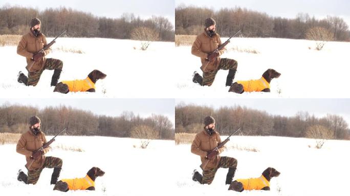 狩猎期间带着他的狗的可怕的年轻人