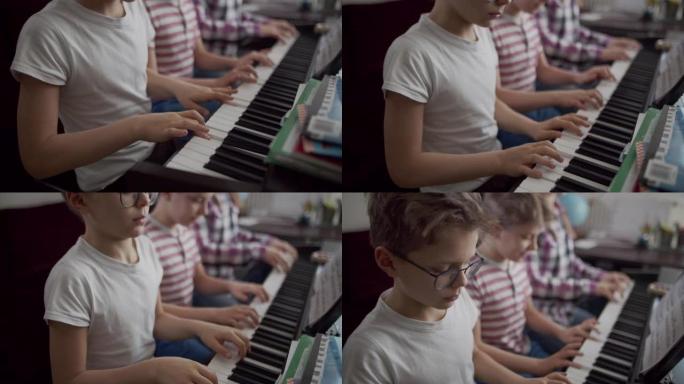三个孩子一起弹数字钢琴