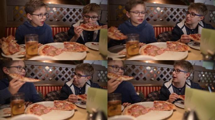 小男孩在餐厅享用披萨