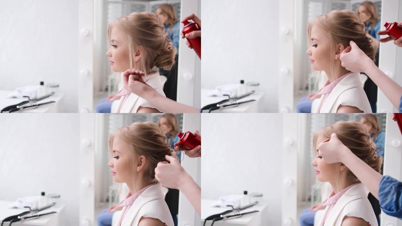 特写美发师整理丰盈发型使用固定发胶。用4K红色相机拍摄