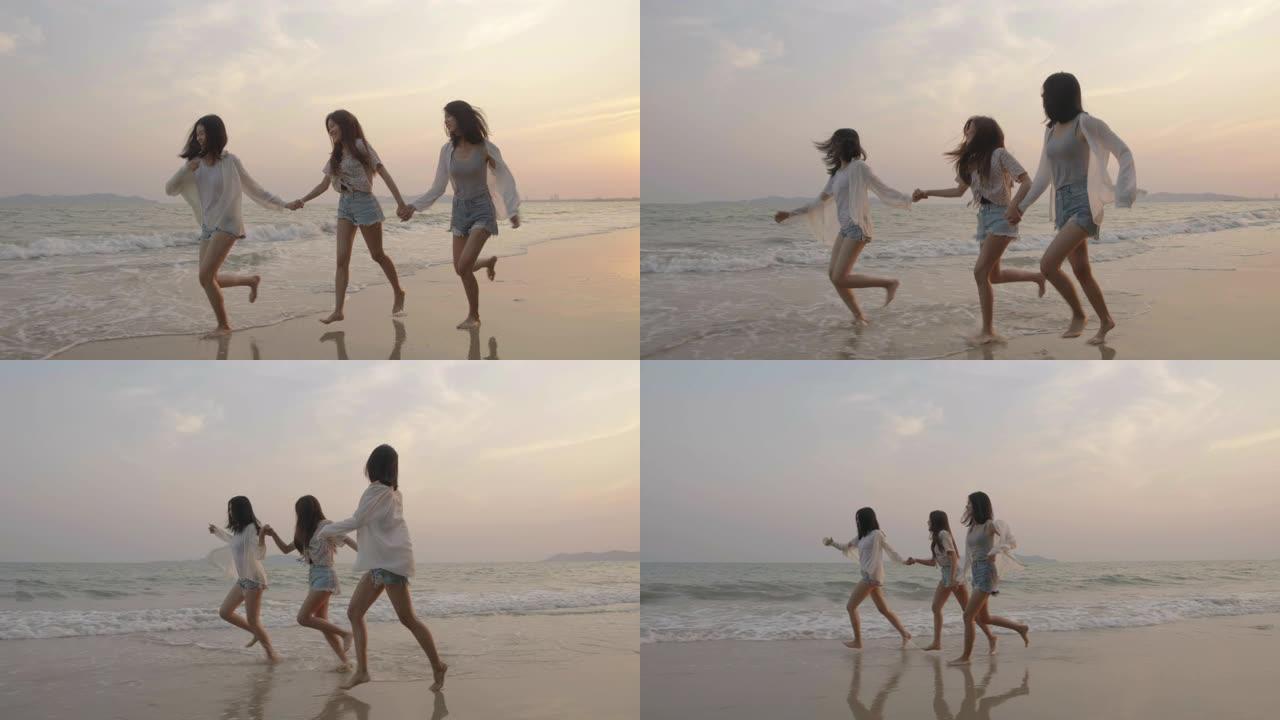 微笑快乐的亚洲朋友一群年轻女性一起在海滩上海边散步暑假日落剪影黄昏假期旅游享受生活周末活动人们的生活