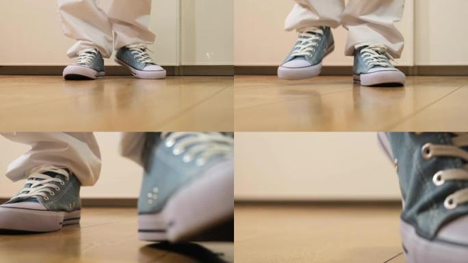 穿着运动鞋的腿运动鞋移到镜头前。