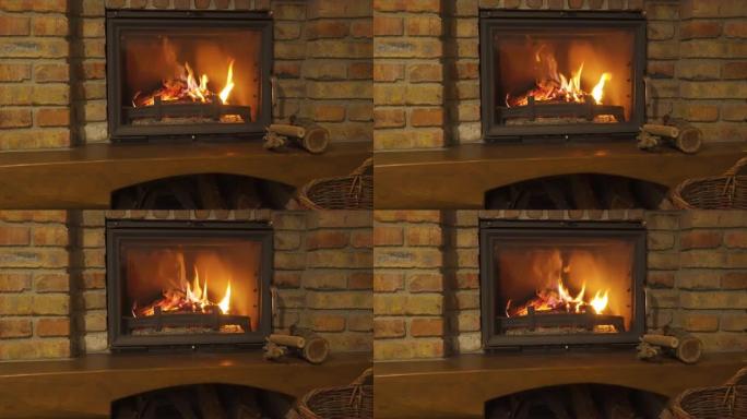 燃烧的壁炉-石头壁炉中的炽热的火在晚上变暖