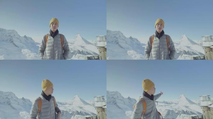 东南亚男子在马特宏峰面前摆姿势拍照