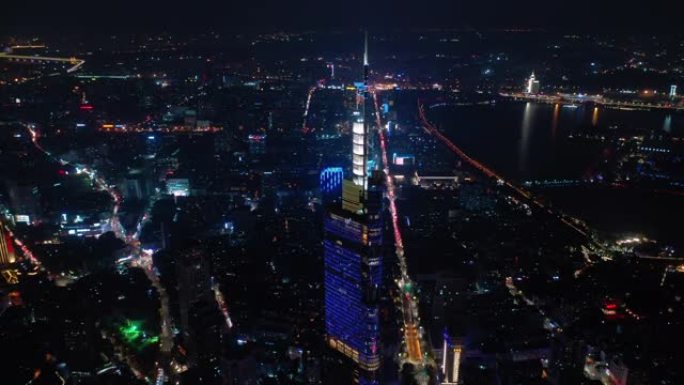 飞越南京城市夜景照明市中心著名塔楼交通街道航空全景4k中国