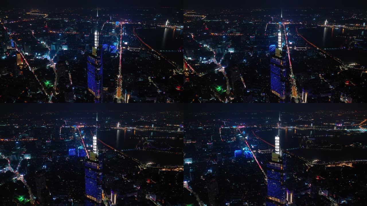 飞越南京城市夜景照明市中心著名塔楼交通街道航空全景4k中国