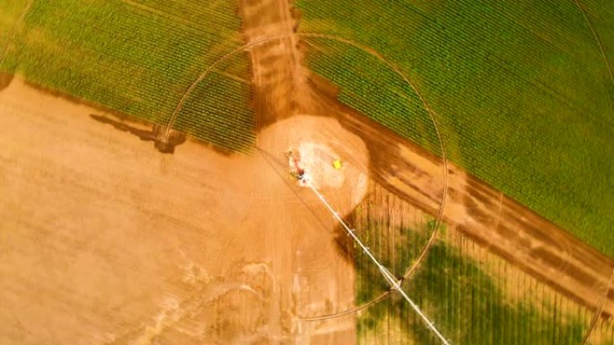 工业农业4k空中俯视图。夏季用农作物灌溉圆田的装置。时间旋转的隐喻