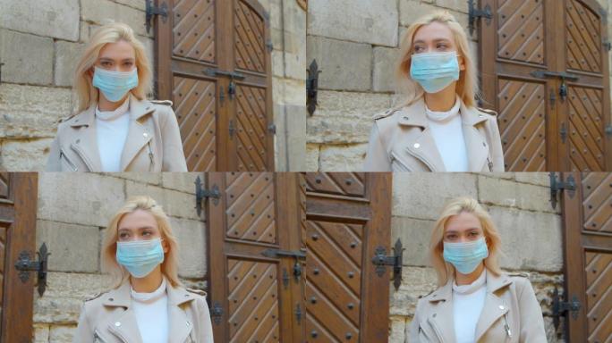 病毒面具妇女在街上佩戴面部保护预防冠状病毒covid 19。女士走在公共空间的检疫食物。