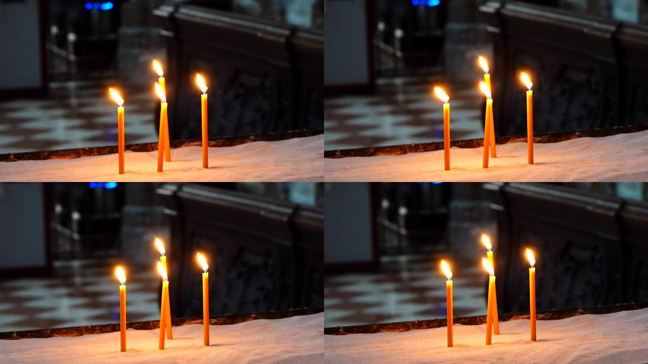 教堂里燃烧的蜡烛蜡烛燃耗祈福祈祷4根蜡烛