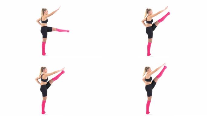 一名专业女运动员练习体操的特写镜头 (前tendu和passe中的平衡)
