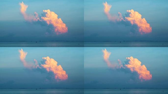 日落时分看到海面上的大云。射。海上美丽的日落和地平线上的白云
