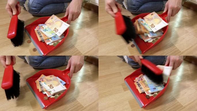 女人在地板上扫钱银行