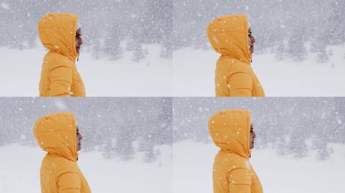 冬季旅行者。年轻的游客在深雪中享受外面的降雪。在冬天的山上玩得开心。肖像。
